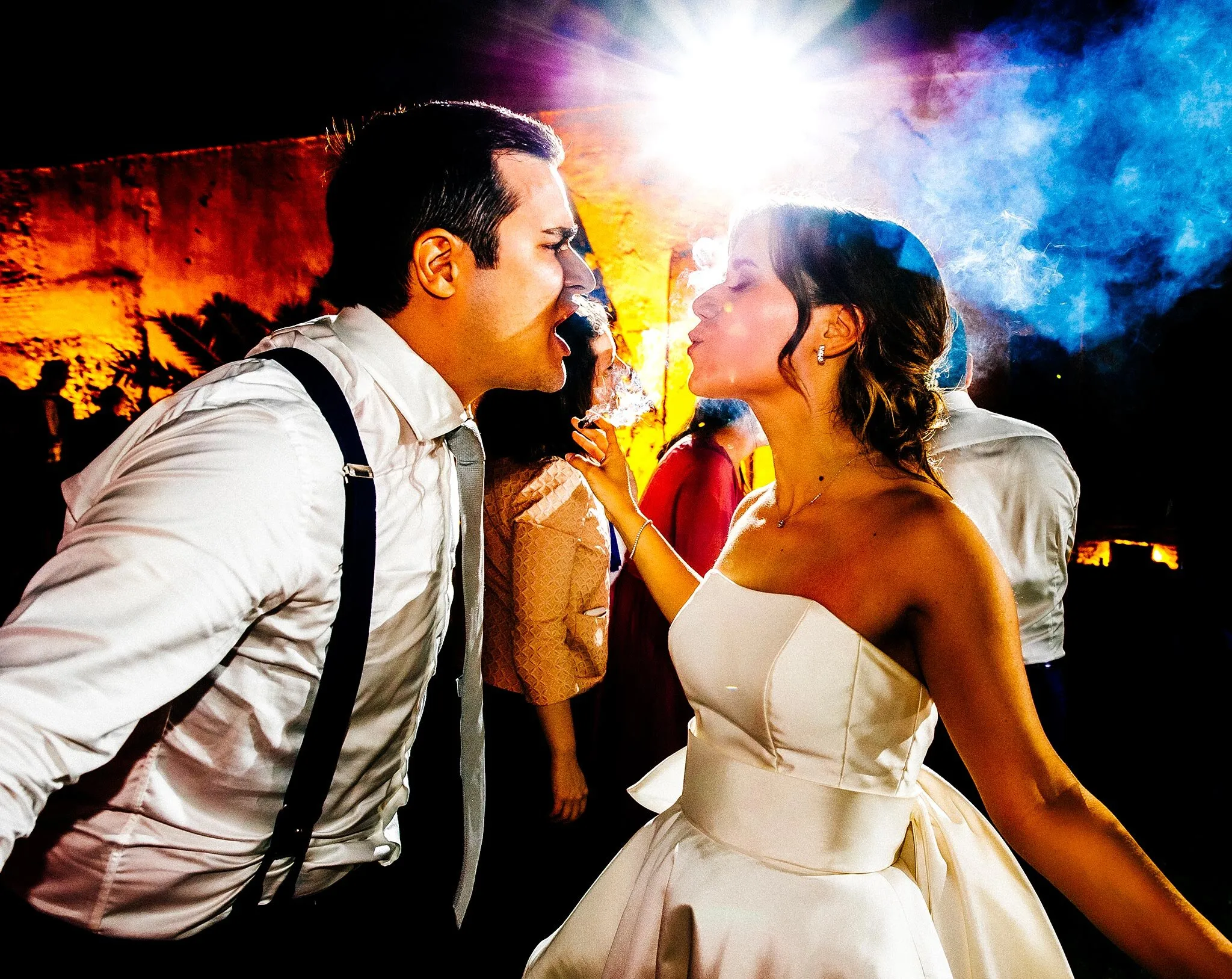 Bride and groom first dance at Italian wedding reception with warm lighting
