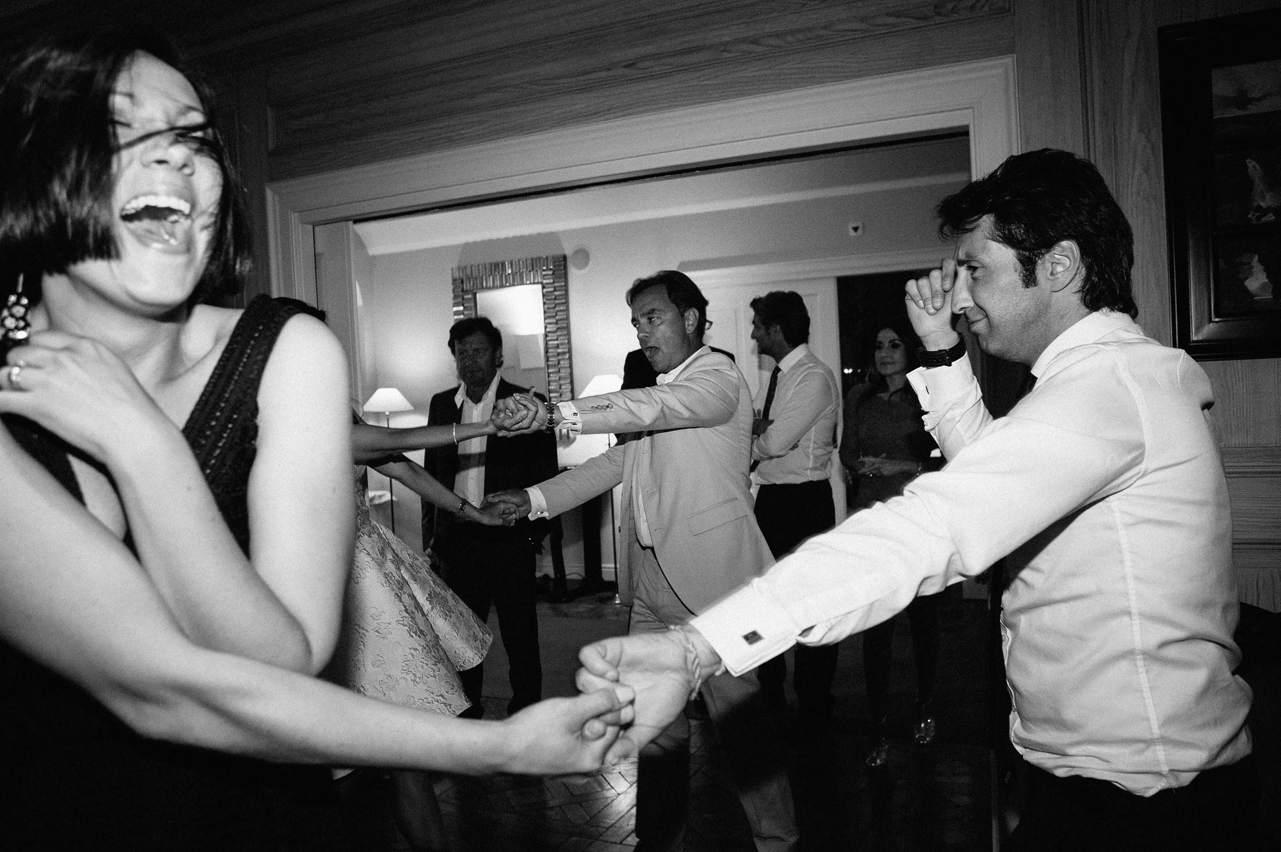 crazy dancing during wedding reception switzerland black and white black and white wedding photography