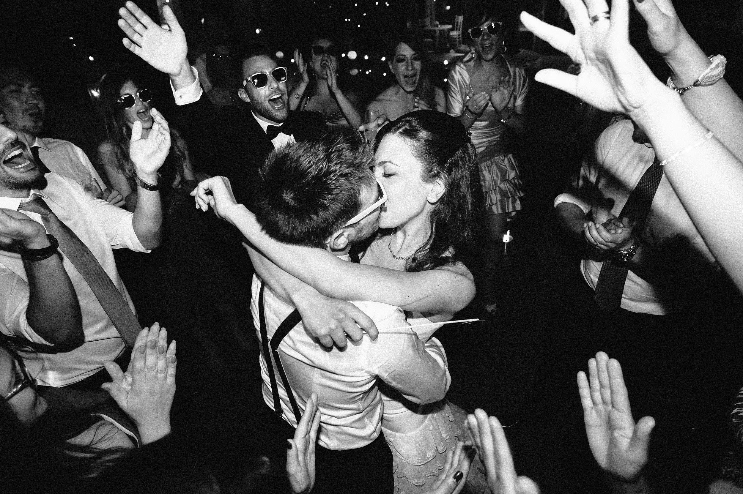 bride and groom kiss on the dancefloor rome italy black and white wedding photography