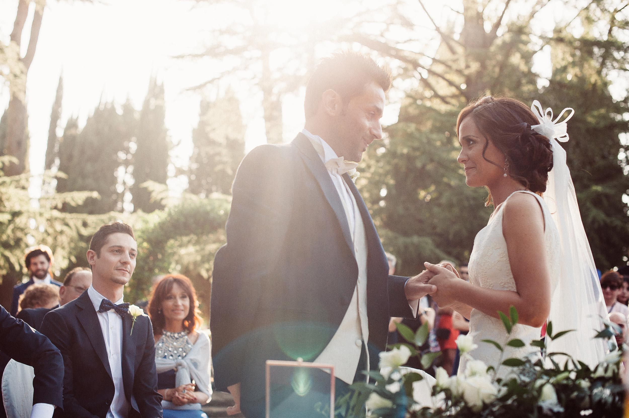 beautiful wedding in italy flare strikes during ring exchange