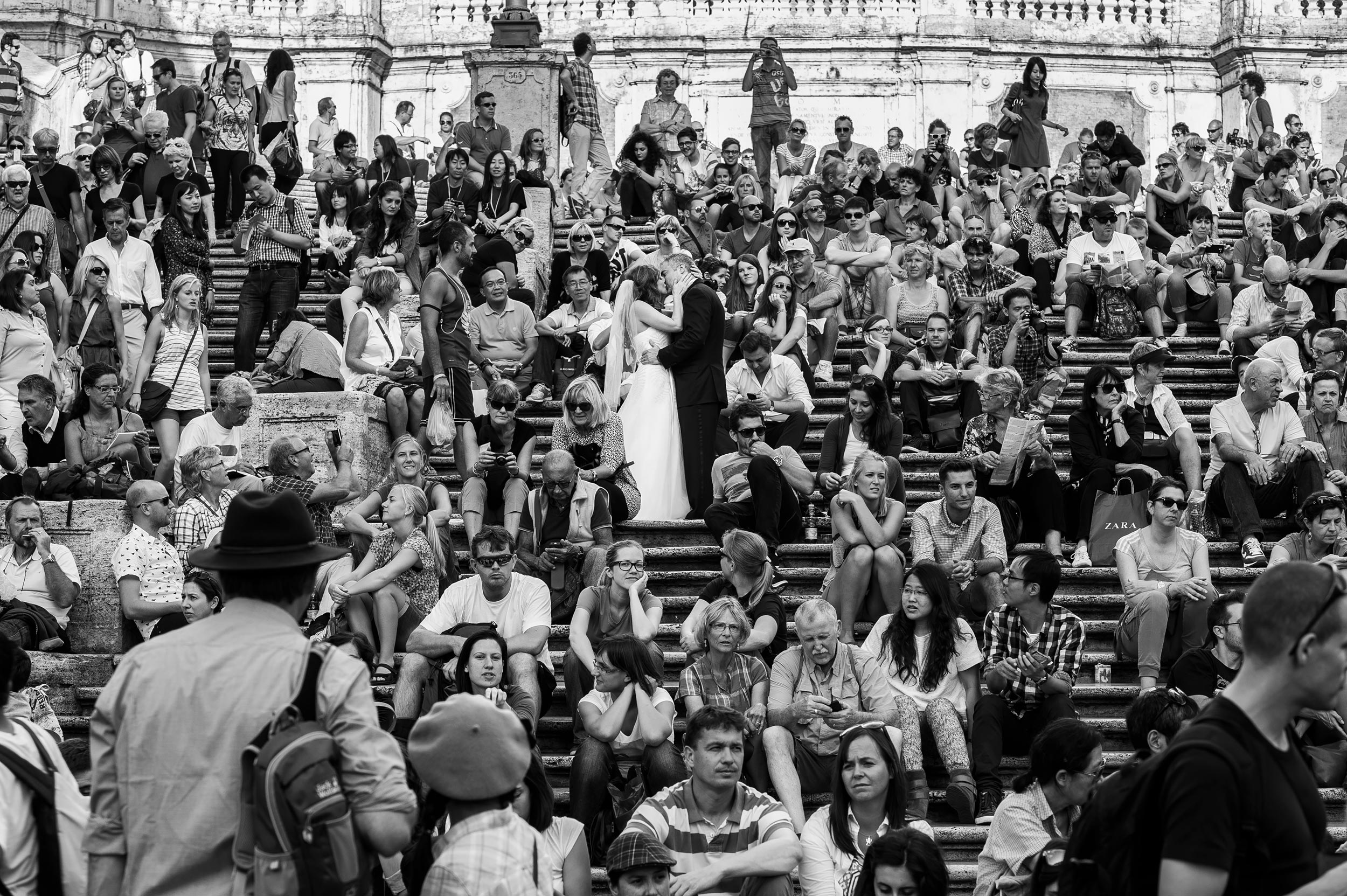 rome spanish steps kiss among the crowd black and white wedding photography